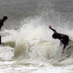 Surfs Ride Waves in Gulf Shores, Ala, Monday, Nov 9, 2009. (AP Photo/Dave Martin)