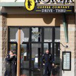 Police stand outside coffee shop in Parkland, Washington where a gunman killed 4 officers on Sunday. (Photo credit: Robert Sorbo/Reuters)