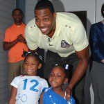 Orlando Magic's Dwight Howard with two young fans