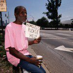 Homeless Man Holds Sign for Help --- Image by © Bob Krist/CORBIS