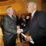 Orlando Mayor Buddy Dyer, left, is congratulated by Gov. Charlie Crist, right, after the passage of the statewide rail transit bill, Tuesday at the Capitol in Tallahassee...COLIN HACKLEY PHOTO