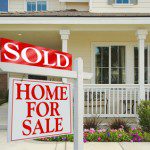 Sold Home For Sale Sign in front of Beautiful New Home.