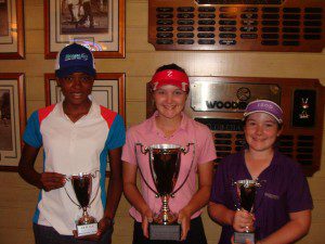 Sabrina & Sydney Hoskins (center and right) proudly show off their winning trophies. 