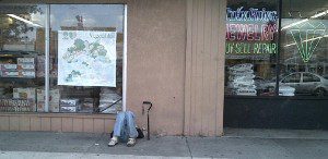 A homeless man lies outside a store front near Mills Avenue, Orlando, January 17, 2013. (Photo: M. Cantone/WONO)