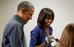 President Barack Obama and First Lady Michelle Obama paint a bookshelf at Burrville Elementary School (Photo: Chris Dilts for Presidential Inauguration Committee 2013)