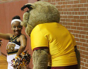 A B-CU cheerleader flirts with B-CU’s Dr. Wild E. Cat. Karsceal Turner- WONO
