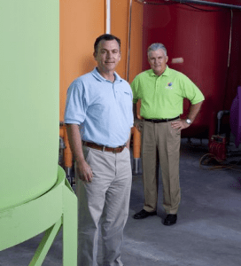 Don and Rick Strube standing in front of their paint vats (Photo: SunColor Paints)