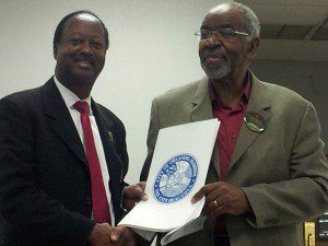 Commission Sam Ings delivers the City of Orlando Mayoral Proclamation to Dr. John Robertson, Executive Director, Multi-Cultural Addictions Network, declaring February 7, 2013, National Black HIV/AIDS Awareness Day. (Photo: WONO)