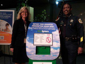 Orange County Sheriff Jerry Demings and Carol Burkett, Director, Orange County Drug Free Office, display a prescription drug drop box, OCSO Central Command, W. Colonial Drive, March 22, 2013 (Photo: WONO)