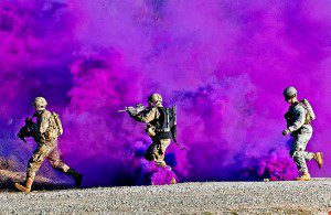 SMOKESCREEN - Two paratroopers and a trainer run through a smokescreen during a live-fire exercise at the Joint Readiness Training Center on Fort Polk, La., Jan. 14, 2012. U.S. Army photo by Sgt. Michael J. MacLeod