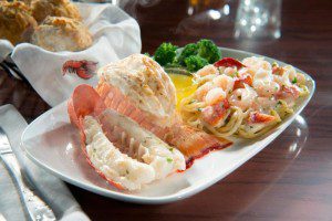 Lobster Lover's Dream: A succulent rock lobster tail and sweet split Maine lobster tail, roasted and served with lobster and shrimp linguini Alfredo.   (PRNewsFoto/Red Lobster)