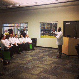 Chef Cary Neff speaking to culinary training students, July 19, 2013. (Photo: Second Harvest - Facebook)