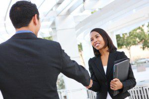 Business People Shaking Hands at Office