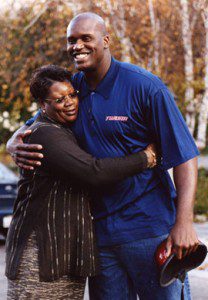 Lucille O'Neal and Shaquille O'Neal share a hug. 