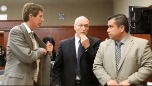 Defense attorneys Mark O'Mara, left, and Don West confer with George Zimmerman at a court hearing June 6, 2013. (Photo credit: Joe Burbank/Pool) 