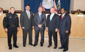 l-r: OPD Chief Paul Rooney, Commissioner Tony Ortiz, Detective..., Orlando Mayor Buddy Dyer and Commissioner Sam Ings, stand together at Orlando City Council, July 22, 2013. (Photo: OPD)