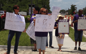 Healthcare workers and 1199 SEUI members picket outside 
