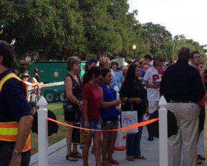 Hundreds of Winter Park and surrounding area residents and visitors wait on line to tour the new SunRail cab cars in downtown Winter Park, September 21, 2013. (Photo: WONO)