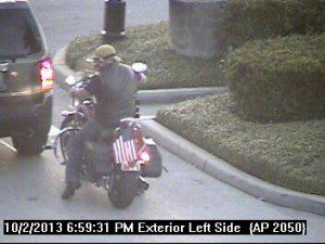 Man drivers away from Target on motorcycle 