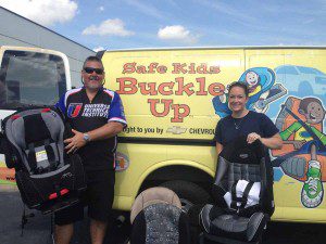 Vinny Barber, marketing manager at UTI-Orlando with Orlando resident Carrisa Johns, occupant protection specialist at the Orange County Sheriff’s Office.