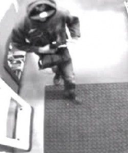 Video still of armed robber