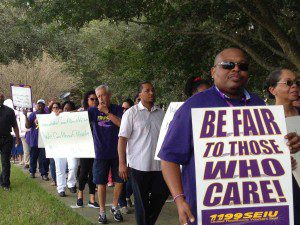 Nursing home caregivers protest for a living wage, quality care for nursing home residents and affordable health insurance, at Consulate Health Care Headquarters in Maitland, Florida, October 17, 2013. (Photo: WONO)