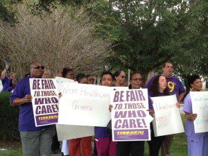Nursing home caregivers, members of 1199 SEIU, pastors, community leaders and supporters, protest outside Consulate Health Care in Maitland, Florida. October 17, 2013. (Photo: WONO)