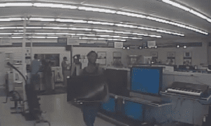 Video still of suspect attempting to steal a television for Cash America Pawn (OCSO)