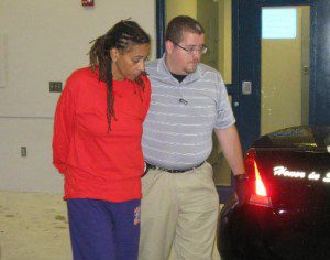 Adele Bing being escorted to a waiting police car (Photo: Winter Haven Police Dept.)