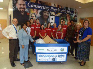 Employees from Goodwill Industries of Central Florida receive donations from Levi Strauss & Co.