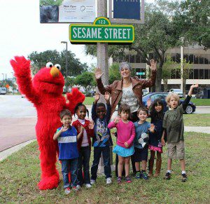 Elmo, Orlando Science Center President and CEO JoAnn Newman, and the Science Center’s own preschoolers gathered at the corner of Princeton St. and Camden Rd. where you’ll find the sign to everyone’s favorite street!