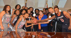 Orange County Mayor Teresa Jacobs poses with OCPS student athletes who helped with NCAA Bracket selections. (Photo credit: Orange County) Government)