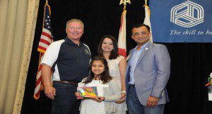 Maya Tharoo, 9, proudly displays her Rising Star award.  (Photo credit: City of Orlando)