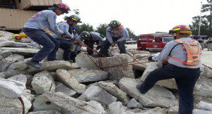 Lake County Fire Rescue's Light Technical Rescue Team navigates through rubble during training at Camp Blanding.
