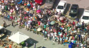 About 1,000 Floridians desperate for food stood in line in near 100 degree temps, in Miami, August 22, 2014. (Video still/CBS-Local)