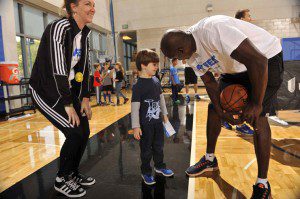 Magic Community Ambassador Bo Outlaw visits with youth and families at the Magic and UnitedHealthcare’s Fit Fest 2015 on Jan. 10. (Photo credit: Gary Bassing.)