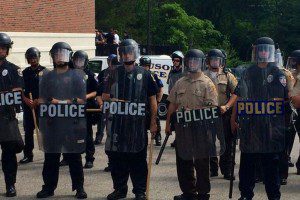Ferguson police officers in riot gear (Photo credit: Twitter/LauraKHettiger)